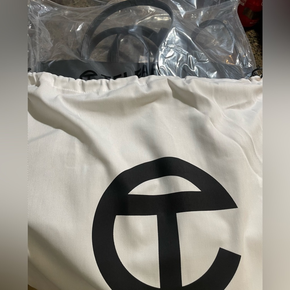Large brand new Telfar tote. Cover included.